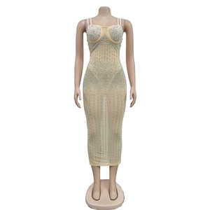 Detail of champagne mesh dress featuring sparkling silver rhinestones and thin straps