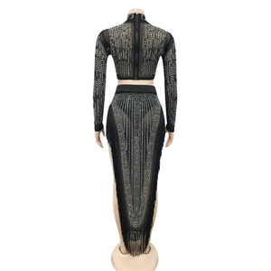 Rear view of black mesh two-piece set featuring silver rhinestones and long fringe tassels