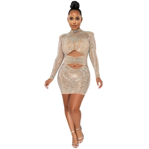 Close-up of sheer mesh party dress with rhinestones and geometric waist cutouts