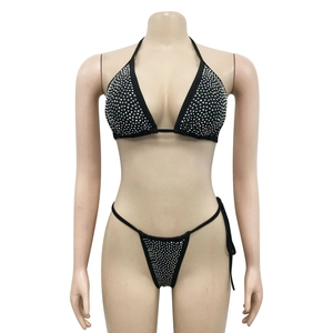 Detail view of black bikini top with sparkling silver rhinestones on sheer mesh fabric