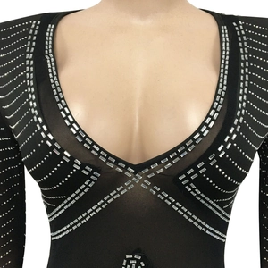 Close-up of sexy mesh dress with sparkling silver rhinestones and deep V-neckline