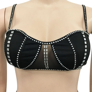 Detail view of black rhinestone camisole with diamond mesh panel and thin straps