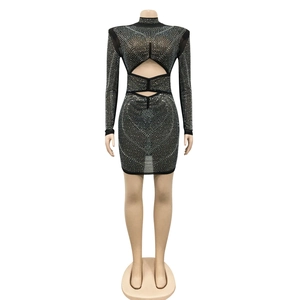 Detail of black mesh mini dress with silver rhinestones and geometric waist cut-outs