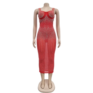 Close-up of sparkling silver rhinestones on red mesh bodycon party dress with thin straps