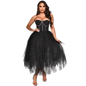 Close-up of black strapless bustier dress with rhinestone trim and tiered tulle mesh