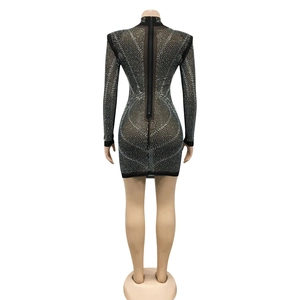 Detail view of black mesh dress with silver rhinestones and long metal back zipper