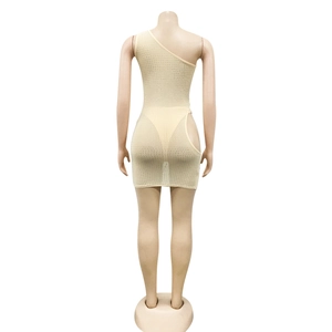 Detail view of beige mesh mini dress with rhinestones and side cut-out on mannequin