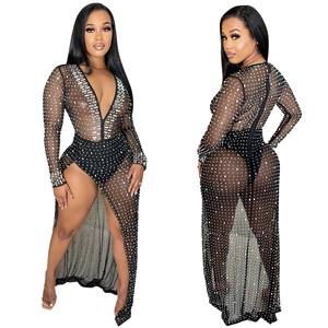 Detail of sexy deep V-neck black mesh dress with rhinestones and high slit leg