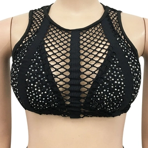 Detailed close-up of a black mesh crop top with shimmering silver rhinestones design