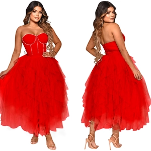 Detail of red tube top corset dress featuring white pearl embellishments and layered mesh