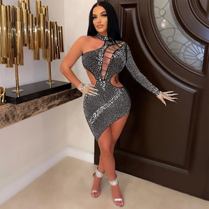 Detailed view of black rhinestone mini dress with sexy cut-outs and one-shoulder design