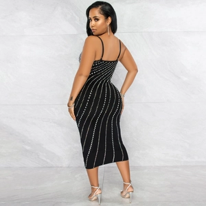Detail of sexy bodycon midi dress with shimmering rhinestone wavy lines and spaghetti straps