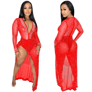 Detail of red deep V-neck dress with sparkling rhinestones and high side slit