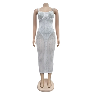 Detailed view of semi-transparent white mesh dress with vertical silver rhinestone stripes