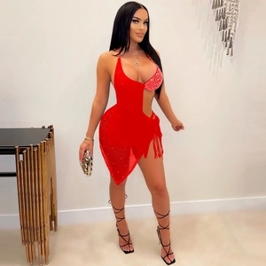 Detail of red tassel dress featuring sparkling rhinestone bodice and sexy side cutout