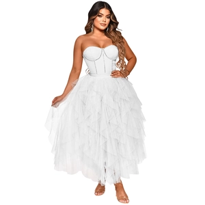 Detail of white strapless evening dress with rhinestone contours and layered tulle skirt