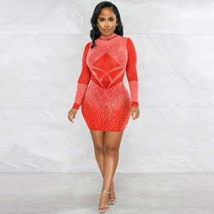 Close-up of red bodycon mesh dress with sparkling silver rhinestone star patterns