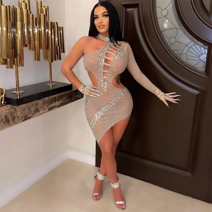 Detailed view of nude rhinestone mini dress with asymmetrical cutout and sparkling crystals