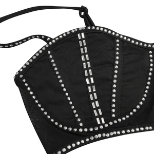 Detailed view of black slim camisole featuring intricate rhinestone geometric patterns