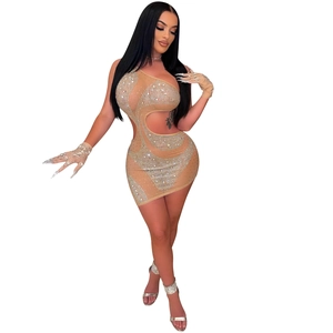 Close-up of sparkling rhinestones and cut-out detail on a nude bodycon mini dress