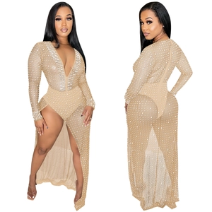 Close-up of elegant V-neck dress with intricate beaded sequins and sheer mesh fabric