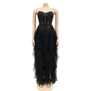 Detail of black strapless evening dress with silver rhinestones and layered tulle skirt