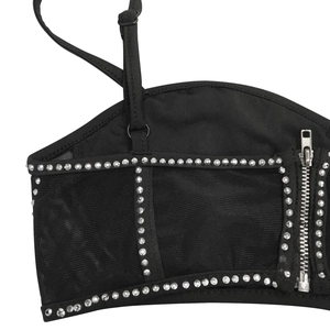 Close-up of black mesh corset top featuring silver rhinestones and metal zipper detail