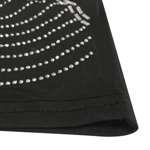 Macro shot of black mesh dress with silver rhinestone wave pattern and stitching