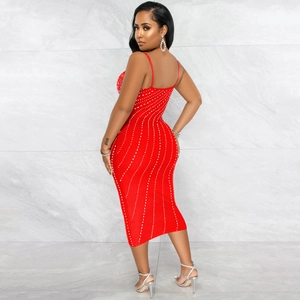 Side view of a sexy red bodycon midi dress with white wavy stripes and spaghetti straps