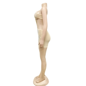 Detailed side view of nude bodycon two-piece set with shimmering rhinestone patterns