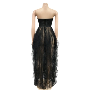 Detail of a black tube top tulle dress featuring a silver back zipper and layered mesh skirt