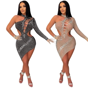 Detailed close-up of rhinestone bodycon dress with cut-outs and matching sparkly gloves