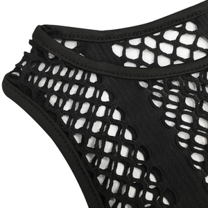 Close-up of black hexagonal mesh fabric with high-quality edge stitching and trim details