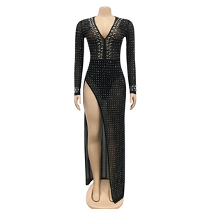 Close-up of black mesh long sleeve dress featuring deep V-neck and sparkling rhinestones