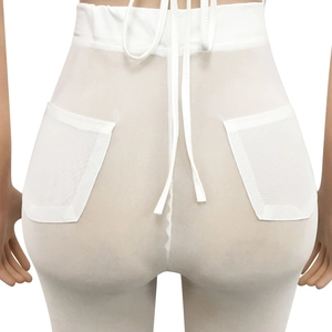 Detail view of white mesh sheer trousers featuring high waist drawstring and back pockets
