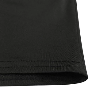 Close-up of double-needle stitching and fine knit texture on black crop top and shorts set