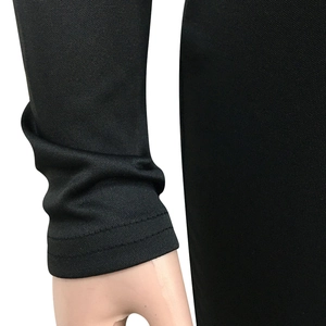 Detailed view of sheer black mesh sleeves featuring high-quality double-needle stitching
