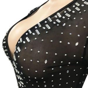 Detail of black mesh fabric with sparkling rhinestones for nightclub party dress