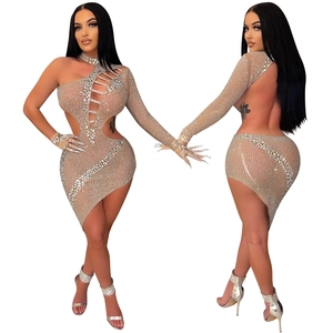 Detail of nude mesh dress with silver rhinestones, one-shoulder cut and asymmetric hemline