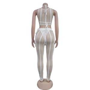 Close-up of white mesh two-piece set featuring back lace-up top and sheer leggings
