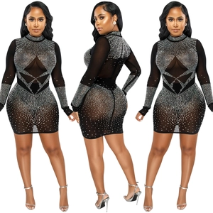 Detailed close-up showing the silver rhinestone pattern on a black mesh party dress