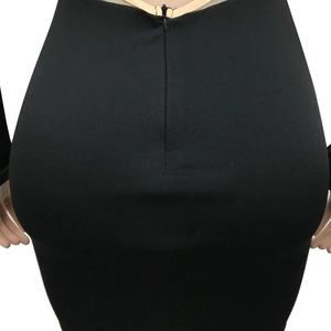 Close-up of invisible zipper closure on back of sexy black mesh bodycon dress