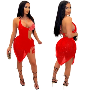 Detail of red tassel two-piece set featuring shimmering rhinestones and fringes