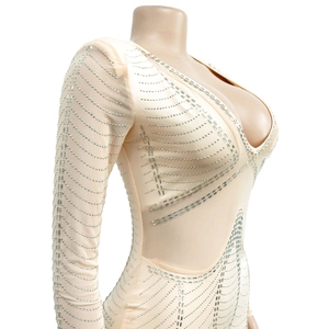 Detail view of mesh sleeves with silver rhinestones on a sexy V-neck bodysuit