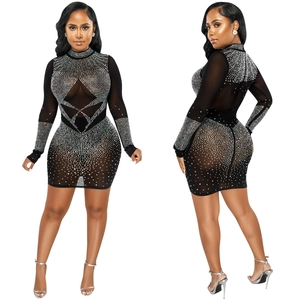 Close-up detail of sheer black mesh dress featuring shimmering silver rhinestones