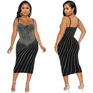 Detailed view of rhinestones and stripes on a black bodycon midi slip dress