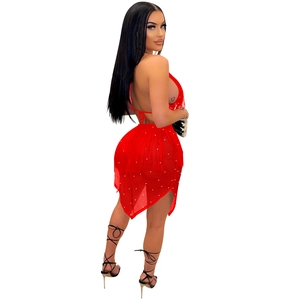 Detail of red tassel dress with rhinestones and halter neck backless design for party