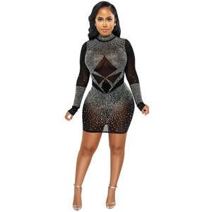Close-up detail of silver rhinestones on black mesh long sleeve bodycon dress