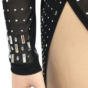 Detailed macro view of black mesh long sleeves with sparkling crystal rhinestones decorations