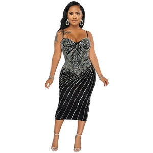 Detail of a black bodycon dress with sparkling silver rhinestones and a sweetheart neckline